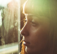 Woman looking out window