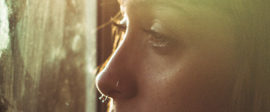 Woman looking out window