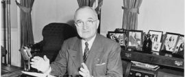 605px Photograph of President Truman at his desk in the Oval Office on the occasion of his speech to the nation on NARA 200355